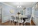 Traditional dining room featuring wood floors, chandelier, and a dining set for six at 57 Glenn Eagles Way, Hiram, GA 30141