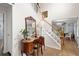Lovely home entryway featuring hardwood floors, staircase, and beautiful decor at 57 Glenn Eagles Way, Hiram, GA 30141