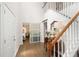 Lovely home entryway featuring hardwood floors, staircase, and beautiful decor at 57 Glenn Eagles Way, Hiram, GA 30141