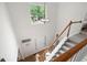 Bright foyer featuring a high ceiling, staircase, and hardwood flooring at 57 Glenn Eagles Way, Hiram, GA 30141