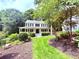 Charming two-story home with a manicured front yard and inviting front porch at 57 Glenn Eagles Way, Hiram, GA 30141