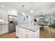 Bright kitchen with granite counters, stainless steel appliances, and an island at 57 Glenn Eagles Way, Hiram, GA 30141