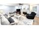 Comfortable living room with a fireplace, plush sofas, and a ceiling fan at 57 Glenn Eagles Way, Hiram, GA 30141