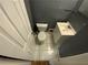 Small bathroom with a toilet and sink featuring white tile flooring at 2273 Childress Dr, Atlanta, GA 30311
