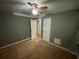 Bedroom with ceiling fan and hardwood floors ready for refurbishment at 2273 Childress Dr, Atlanta, GA 30311