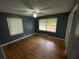 Bedroom with hardwood floors, two windows with blinds and a ceiling fan at 2273 Childress Dr, Atlanta, GA 30311