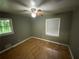 Bedroom featuring two windows, hardwood floors, and a ceiling fan at 2273 Childress Dr, Atlanta, GA 30311