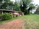Charming one-story brick home with a well-maintained lawn and mature trees offering great curb appeal at 2273 Childress Dr, Atlanta, GA 30311