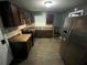 Functional kitchen with dark cabinets, stainless steel appliances, and a durable countertop at 2273 Childress Dr, Atlanta, GA 30311