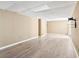 Spacious basement area featuring modern flooring, neutral walls, and tv mount at 2895 Shurburne Dr, Alpharetta, GA 30022