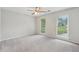 Carpeted bedroom with natural light from large windows at 2895 Shurburne Dr, Alpharetta, GA 30022