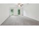 Spacious bedroom featuring soft carpet and large windows that offer views of the yard at 2895 Shurburne Dr, Alpharetta, GA 30022