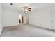 Expansive bedroom offers neutral carpet and view into ensuite bathroom at 2895 Shurburne Dr, Alpharetta, GA 30022