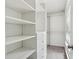 Walk-in closet with adjustable shelving, built-in drawers, and ample storage space at 2895 Shurburne Dr, Alpharetta, GA 30022