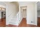Bright hallway showcasing hardwood floors, staircase, and modern architectural details at 2895 Shurburne Dr, Alpharetta, GA 30022