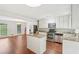 Modern kitchen with white cabinets, granite countertops, island and stainless steel appliances at 2895 Shurburne Dr, Alpharetta, GA 30022