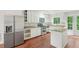 Modern kitchen featuring stainless steel refrigerator, granite countertops and white cabinets at 2895 Shurburne Dr, Alpharetta, GA 30022
