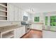 Traditional kitchen featuring granite countertops, stainless steel appliances, and ample natural light at 2895 Shurburne Dr, Alpharetta, GA 30022