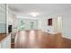 Bright living room featuring hardwood floors, fireplace, and wainscotting detail at 2895 Shurburne Dr, Alpharetta, GA 30022