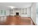 Bright living room with hardwood floors, built-in bookcases, and a fireplace at 2895 Shurburne Dr, Alpharetta, GA 30022