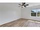 Bedroom featuring wood-look floors, a ceiling fan, and a window that provides natural light at 3552 Clear Creek Nw Xing, Kennesaw, GA 30144