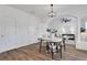 Well-lit dining area with wood flooring, seamlessly connected to the living space, ideal for entertaining at 3552 Clear Creek Nw Xing, Kennesaw, GA 30144