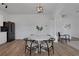 Bright dining area with white round table, black chairs, and modern light fixture, perfect for entertaining at 3552 Clear Creek Nw Xing, Kennesaw, GA 30144