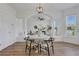 Open-concept dining area featuring wood floors and bright white walls, great for Gathering gatherings at 3552 Clear Creek Nw Xing, Kennesaw, GA 30144