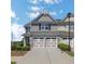 Charming townhome featuring a two-car garage and well-maintained landscaping at 3552 Clear Creek Nw Xing, Kennesaw, GA 30144