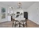 Modern eat-in kitchen featuring stainless steel appliances, black accents, and white cabinets at 3552 Clear Creek Nw Xing, Kennesaw, GA 30144