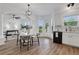 Open-concept kitchen and dining area with stainless steel appliances and bright natural light at 3552 Clear Creek Nw Xing, Kennesaw, GA 30144