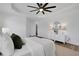 Spacious bedroom featuring a tray ceiling, wood flooring, and stylish decor at 3552 Clear Creek Nw Xing, Kennesaw, GA 30144