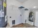 Utility room with a hot water heater, plumbing fixtures and vinyl flooring at 3552 Clear Creek Nw Xing, Kennesaw, GA 30144