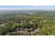 Aerial view of neighborhood, trees, and lake at 4675 Lakeway Pl, Alpharetta, GA 30005