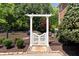 Enclosed backyard features white trellis, privacy fence, and tasteful landscaping at 4675 Lakeway Pl, Alpharetta, GA 30005