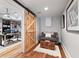 Basement with cozy seating area and a view into the adjacent office space through a barn door at 4675 Lakeway Pl, Alpharetta, GA 30005