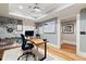 Well-lit basement home office featuring a unique desk, and a bright view to the hall at 4675 Lakeway Pl, Alpharetta, GA 30005