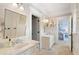 Bathroom with marble countertop vanity and white cabinets at 4675 Lakeway Pl, Alpharetta, GA 30005