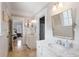 Elegant bathroom featuring marble countertops and double vanities adjacent to the main bedroom at 4675 Lakeway Pl, Alpharetta, GA 30005