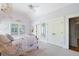 Stylishly decorated bedroom with vaulted ceiling, open windows and view to a bedroom with wardrobe at 4675 Lakeway Pl, Alpharetta, GA 30005