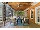 Charming covered patio with ceiling fans and cozy seating area, ideal for outdoor entertaining at 4675 Lakeway Pl, Alpharetta, GA 30005