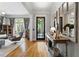 Inviting foyer with hardwood floors, stylish decor, and a view into the living area at 4675 Lakeway Pl, Alpharetta, GA 30005