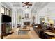 Bright living room features coffered ceiling, stone fireplace, hardwood floors, and comfortable seating at 4675 Lakeway Pl, Alpharetta, GA 30005
