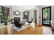 Bright living room with hardwood floors, fireplace, and elegant seating at 4675 Lakeway Pl, Alpharetta, GA 30005