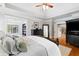 Bright main bedroom shows access to sitting room, and hardwood floors at 4675 Lakeway Pl, Alpharetta, GA 30005