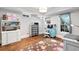 Bright home office with hardwood floors, natural light, and built in storage at 4675 Lakeway Pl, Alpharetta, GA 30005