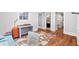 Inviting home office with hardwood floors, neutral paint color, and natural light at 4675 Lakeway Pl, Alpharetta, GA 30005