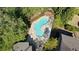Aerial view of the community pool with lounge chairs and lush tree surround at 4675 Lakeway Pl, Alpharetta, GA 30005