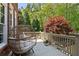 Cozy back porch features a unique egg-shaped chair with plush cushions, offering a relaxing retreat overlooking the backyard at 4675 Lakeway Pl, Alpharetta, GA 30005