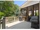 This lovely porch features a grilling area, a screened-in area, and calming views of the surrounding greenery at 4675 Lakeway Pl, Alpharetta, GA 30005